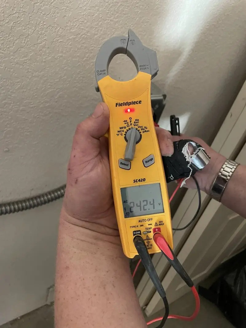 Voltage testing with clamp meter during Electrical Installation Services in Metuchen